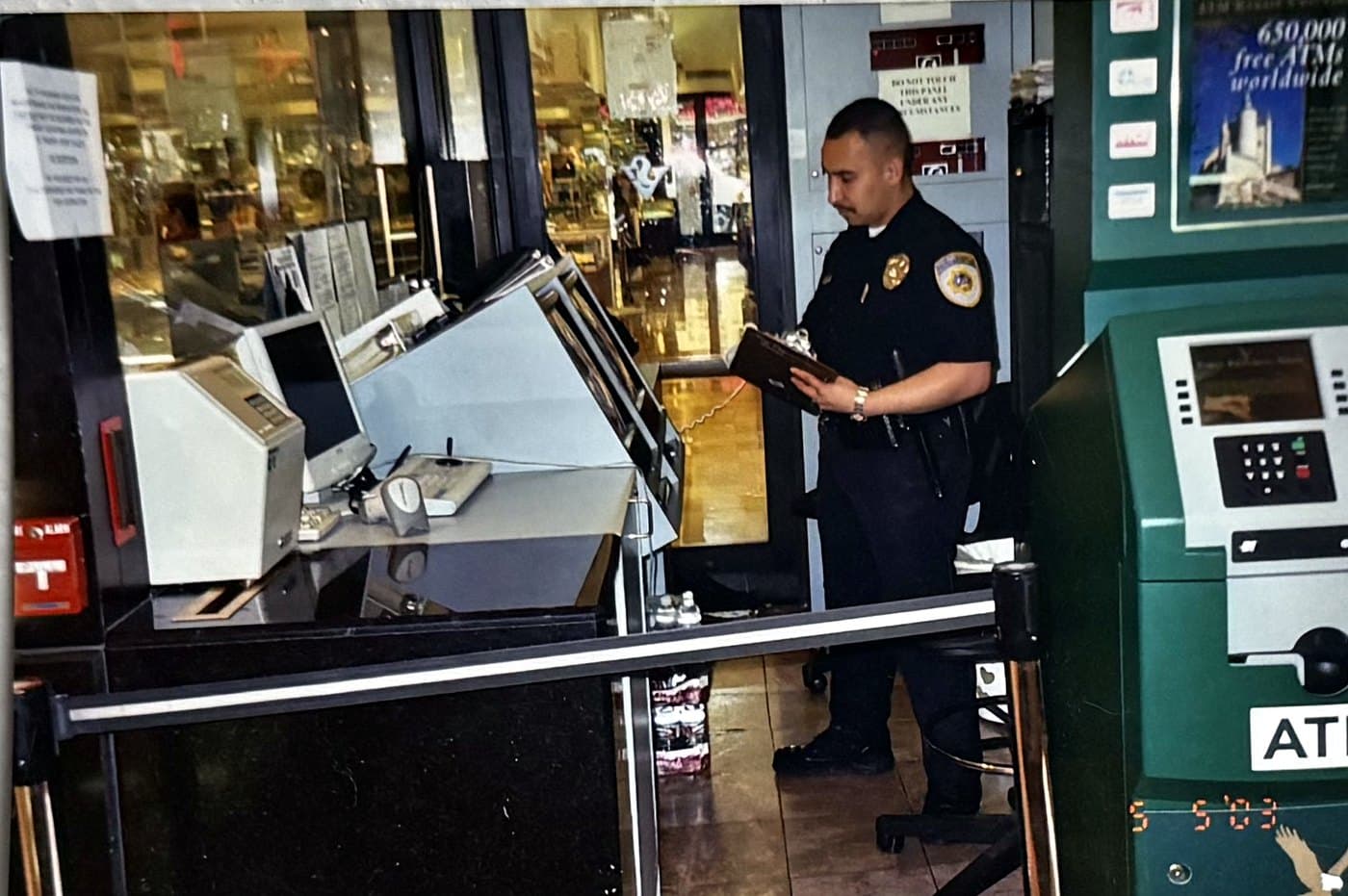 Officer completing a written activity report on post