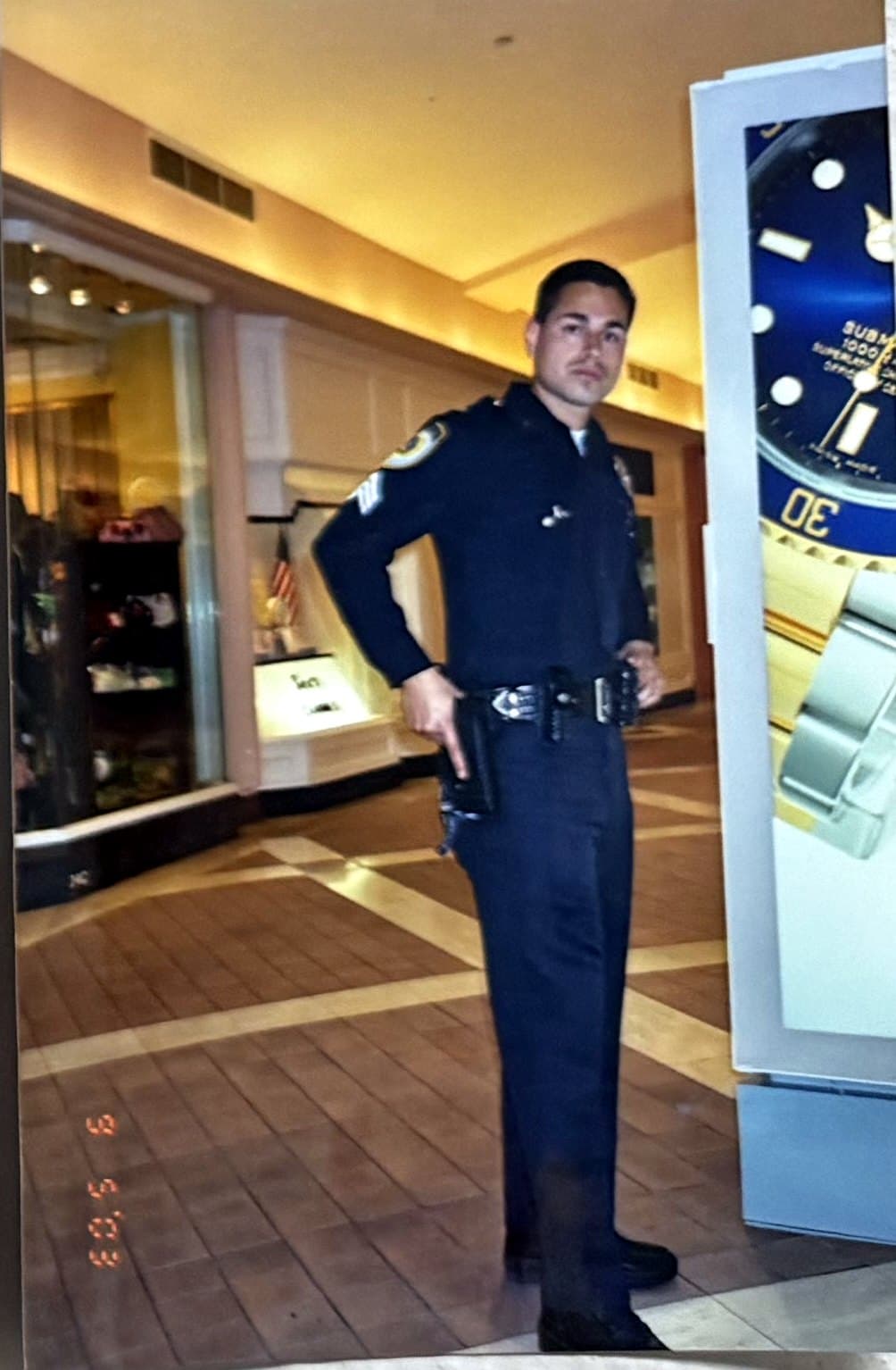 Uniformed officer posted at a retail mall entrance